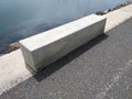 Aerial view of rectangular concrete bench together on pier. Urban furniture concept. Architecture and concrete construction