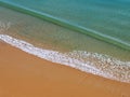 Aerial view of red beach sand with blue ocean and waves Royalty Free Stock Photo