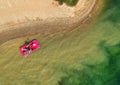 Aerial view of a red boat on a lake