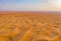 Aerial view of red Desert Safari with sand dune in Dubai City, United Arab Emirates or UAE. Natural landscape background at sunset Royalty Free Stock Photo