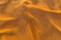 Aerial view of red Desert Safari with sand dune in Dubai City, United Arab Emirates or UAE. Natural landscape background at sunset Royalty Free Stock Photo