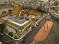 An aerial view of Red Giant Swing and Suthat Thepwararam Temple at sunset scene