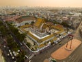 An aerial view of Red Giant Swing and Suthat Thepwararam Temple at sunset scene