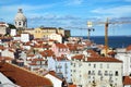 Aerial view of the red roofs of Alfama the historic area of Lisbon on the coast of the Atlantic Ocean. Royalty Free Stock Photo