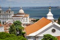 Aerial view of the red roofs of Alfama the historic area of Lisbon on the coast of the Atlantic Ocean. Royalty Free Stock Photo