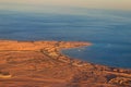 Aerial view on Red sea, Arabian desert and touristic resort near Hurghada, Egypt. View from airplane Royalty Free Stock Photo