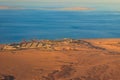 Aerial view on Red sea, Arabian desert and touristic resort near Hurghada, Egypt. View from airplane Royalty Free Stock Photo