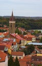 Aerial view of red tile roofs in Telc. Clock tower in historic centre of Telc. A UNESCO World Heritage Site