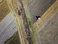 Aerial view of Tractor harrowing soil