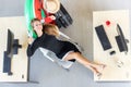 Aerial view of Relaxed business woman holding passport and lying on comfortable office chair in office. Summer vacations concept Royalty Free Stock Photo