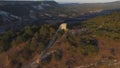 Aerial view on remains of an ancient observation tower in the mountains. Shot. Watch tower of the ancient city in the Royalty Free Stock Photo