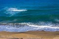 Aerial view of a remote sandy beach and sea waves Royalty Free Stock Photo