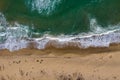 Aerial view of a remote sandy beach and sea waves Royalty Free Stock Photo