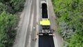 Aerial view on repair of a highway, the process of laying a new asphalt covering, Road construction works. Royalty Free Stock Photo