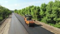 Aerial view on repair of a highway, the process of laying a new asphalt covering, Road construction works. Royalty Free Stock Photo