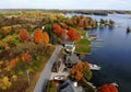 The aerial view of the residential area and waterfront homes surrounded by colorful fall foliage near Wellesley Island, New York, Royalty Free Stock Photo