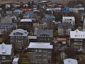 Aerial view of residential houses in the center of Reykjavik, Iceland, with colorful roofs, gardens and bare trees in winter. Royalty Free Stock Photo