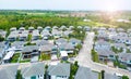 Aerial view of residential houses and driveways neighborhood during a fall sunset or sunrise time. Tightly packed homes. Royalty Free Stock Photo