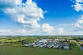 Aerial view of residential houses neighborhood and apartment building complex at sunset. Tightly packed homes, driveway surrounds Royalty Free Stock Photo