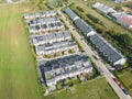 Aerial view of residential houses neighborhood and apartment building complex at sunset. Tightly packed homes, driveway surrounds Royalty Free Stock Photo