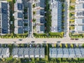 Aerial view of residential houses neighborhood and apartment building complex at sunset. Tightly packed homes, driveway surrounds Royalty Free Stock Photo