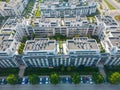 Aerial view of residential houses neighborhood and apartment building complex at sunset. Tightly packed homes, driveway surrounds Royalty Free Stock Photo