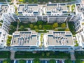 Aerial view of residential houses neighborhood and apartment building complex at sunset. Tightly packed homes, driveway surrounds Royalty Free Stock Photo