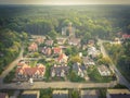 Aerial view of residential houses neighborhood and apartment building complex at sunset. Tightly packed homes, driveway surrounds Royalty Free Stock Photo
