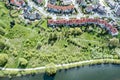 Aerial view of residential houses in suburban area near river Royalty Free Stock Photo