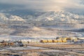 Aerial view of residential neighborhood against overcast sky and snowy mountain Royalty Free Stock Photo