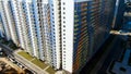 Aerial view of residential skyscrapers in the new expanding city district. Motion. Housing development and