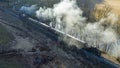 Aerial View of a Restored Narrow Gauge Steam Passenger Train Traveling With a Full Head of Steam