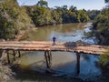 Aerial view of a rickety wooden bridge.