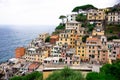 Aerial view of Riomaggiore with a town built into the side of a steep cliff, overlooking the sea Royalty Free Stock Photo