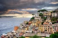 Aerial view of Riomaggiore with a town built into the side of a steep cliff, overlooking the sea Royalty Free Stock Photo