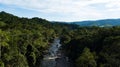 Aerial view on a river crossing the amazon rainforest in Peruvian jungle. Royalty Free Stock Photo