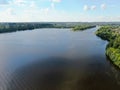 Aerial view river cruise ship sails along the river surrounded by beautiful green forest in summer on a sunny day Cruise Ship Trip Royalty Free Stock Photo