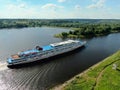 Aerial view river cruise ship sails along the river surrounded by beautiful green forest in summer on a sunny day Cruise Ship Trip Royalty Free Stock Photo