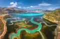 Aerial view of river delta, boats and yachts in lagoon, mountains