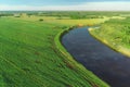 Aerial view of river and forest at summer sunny day, sky reflecting in water. Royalty Free Stock Photo