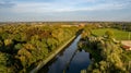 Aerial view the river on green forest plain. Amazing aerial shot of beautiful blue river. Forest background. Royalty Free Stock Photo