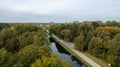 Aerial view the river on green forest plain. Amazing aerial shot of beautiful blue river. Forest background. Royalty Free Stock Photo