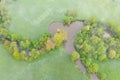 Aerial view of river meander in the lush green vegetation of the delta Top view of the valley of a meandering river among green