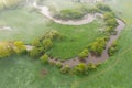 Aerial view of river meander in the lush green vegetation of the delta Top view of the valley of a meandering river among green Royalty Free Stock Photo