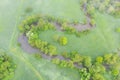 Aerial view of river meander in the lush green vegetation of the delta Top view of the valley of a meandering river among green Royalty Free Stock Photo