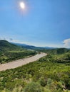 aerial view of a river in the mountains during the summer