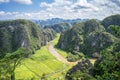 Aerial view of the river among rice fields and limestone mountains, vietnamese scenic landscape at ninh Binh Vietnam