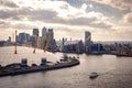Aerial view of River Thames, North Greenwich and the Docklands on a cloudy day in London, England Royalty Free Stock Photo