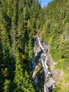 Aerial View of River and waterfall with green trees in Canadian Mountain Landscape Royalty Free Stock Photo