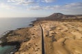 view of a road along the coast crossing the Sand Dune Natural Park in Corralejo, Fuerteventura, Canary Islands, Spain Royalty Free Stock Photo